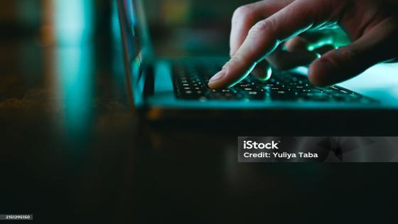 laptop keyboard with a stock market graph